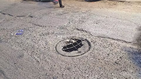 Broken manhole in the middle of the road in Kodambakkam