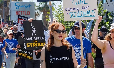 SAG-AFTRA actors strike against the Hollywood studios as they join the Writers Guild of America (WGA) on the picket like outside of Netflix offices in Angeles, California (Reuters)