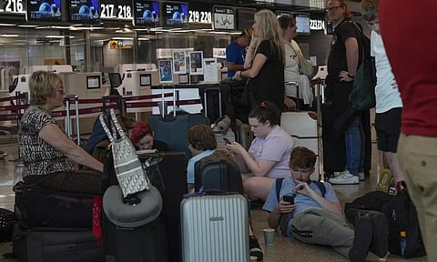 Passengers wait for the check-in of their flights during a nationwide strike of airports ground staff, and check-in services at Rome’s Fiumicino International airport in Fumicino, Italy. (AP)