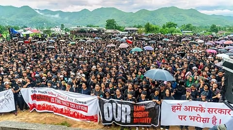 Members of Indigenous Tribal Leaders Forum (ITLF) take part in a rally as a mark of protest against the incident of women being paraded naked on May 4 in Manipur