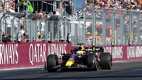 Red Bull’s Max Verstappen passes the chequered flag to win the Hungarian Grand Prix