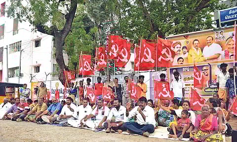 Residents staging a protest in front of the Collectorate in Tiruchy on Monday
