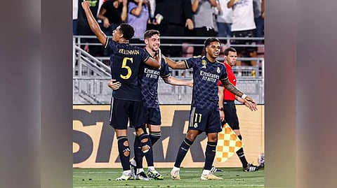 Real Madrid players celebrating after scoring a goal