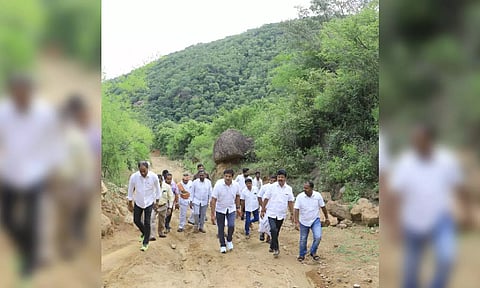 Collector Kumaravel Pandian trekking up the Alleri Hills in Anaicut panchayat union