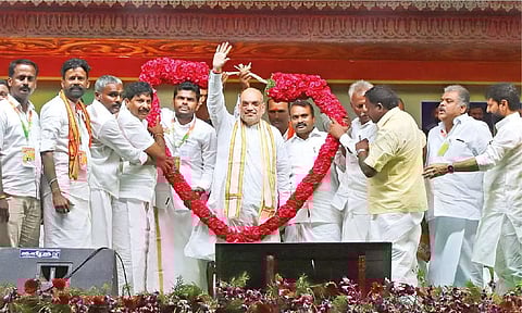 Home Minister Amit Shah being garlanded at the launch of BJP state president K Annamalai’s padayatra ‘En Mann, En Makkal in Rameswaram on Friday