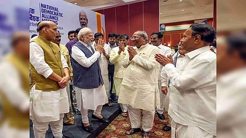 Prime Minister Narendra Modi greets the National Democratic Alliance (NDA) leaders in New Delhi on Tuesday. (ANI/Photo)