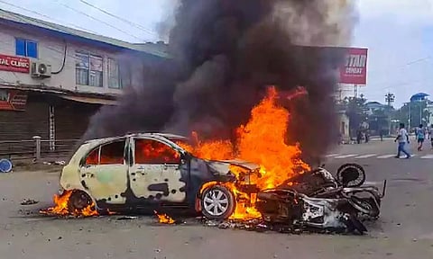 Vehicles in flames after violence broke out during the 'Tribal Solidarity March' called by All Tribal Student Union Manipur (ATSUM), in Imphal. (PTI)