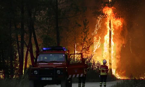 Firefighters watch a wildfire in Ourem, Santarem district, Portugal. File photo: Reuters