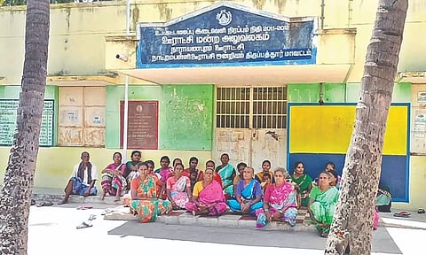 Women staging a sit-in protest in front of the Narayanapuram panchayat office.