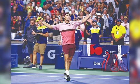Tommy Paul reacts after winning his match against Carlos Alcaraz