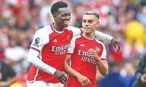 Arsenal’s Eddie Nketiah celebrates with Leandro Trossard after the win.