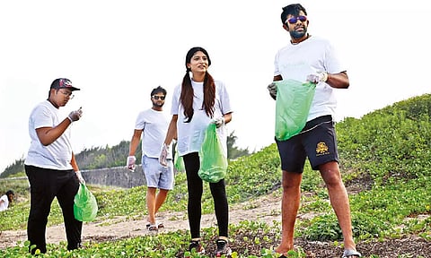 Samyuktha Adityan, founder of Naturallé, and Sivanthi Adityan, Daily Thanthi group Director, with other volunteers during the beach clean-up drive
