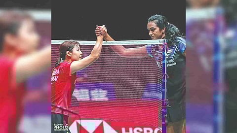 Nozomi Okuhara shakes hands with PV Sindhu after their match