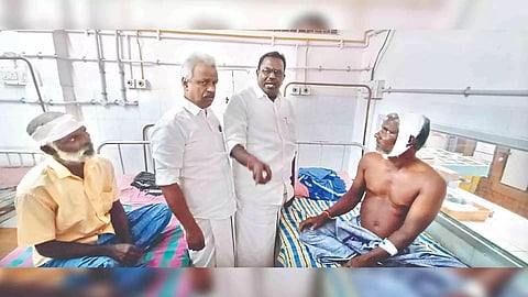 Injured fishermen being consoled by local leaders at the hospital on Wednesday