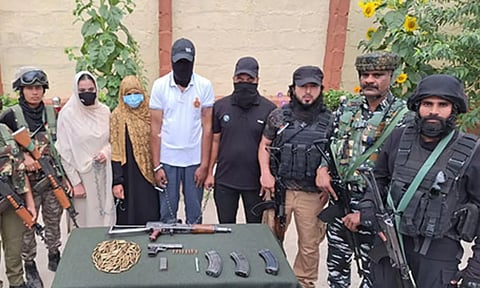 Visuals of seized arms cache and arrested terror operatives (ANI)