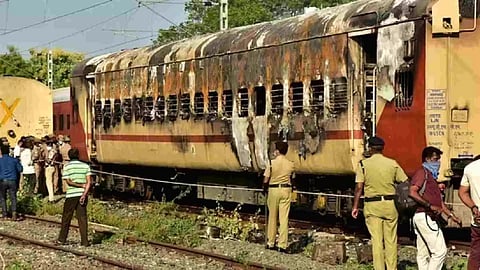 Security personnel at the spot after a fire broke out in a coach of a train at Madurai railway station, Saturday (Photo/PTI)