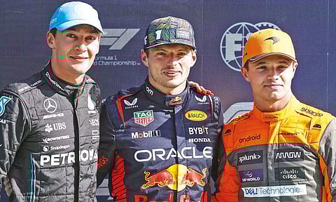 Mercedes' George Russell, Red Bull's Max Verstappen and McLaren's Lando Norris pose after taking the leading positions in the qualifying session&nbsp;