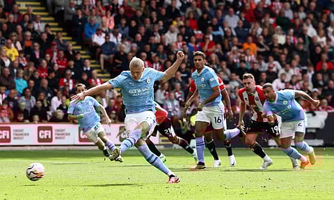 Manchester City’s Erling Haaland shoots from the penalty spot