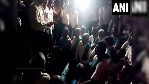 Farmers in Mandya staging a late-night protest on Wednesday against CWRC's recommendation (Photo/ANI)