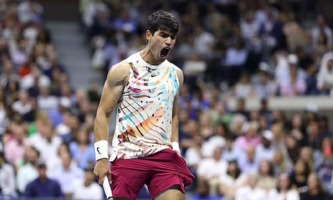 Carlos Alcaraz celebrates his win against Lloyd Harris