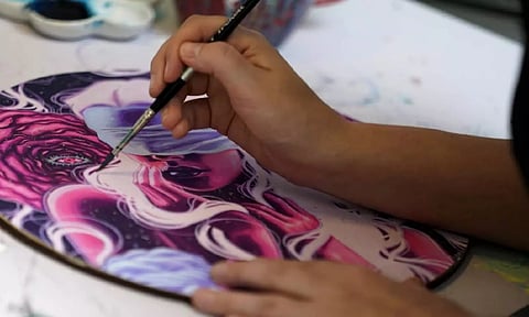 Artist McKernan paints in her studio (Photo:AP)