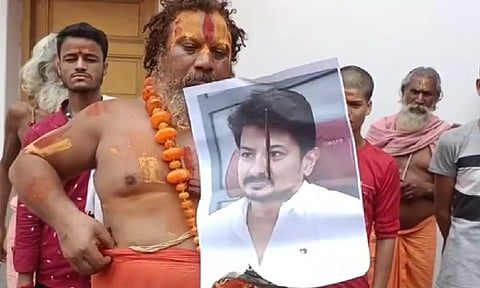Sant Paramhans Acharya with Udhayanidhi poster on his hand to protest against him on his ' Sanatan Dharma' remark. (IANS)