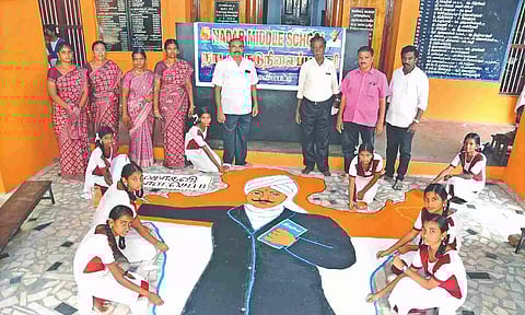 Students drawing rangoli of poet Mahakavi Subramania Bharathi at Nadar Middle School
in Kovilpatti, Thoothukudi on Monday