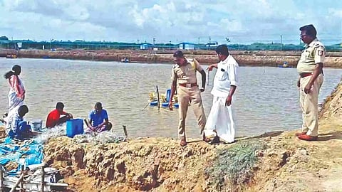 Chandrabose shows the damaged farm to the police on Saturday in Nagapattinam