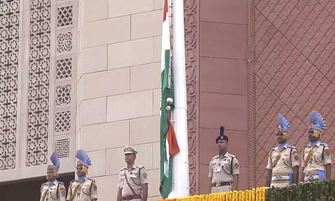 Rajya Sabha Chairman hoists national flag at new parliament building (ANI)
