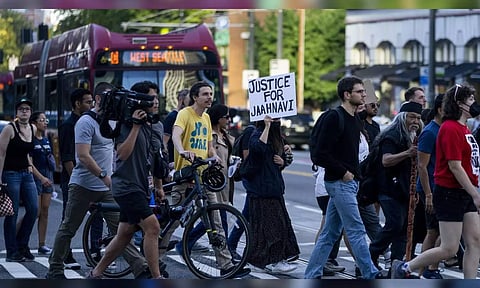 Protesters march through downtown Seattle after body camera footage was released of a Seattle police officer joking about the death of Jaahnavi Kandula, a 23-year-old woman hit and killed in January by officer Kevin Dave in a police cruiser on September 14, 2023, in Seattle. (AP)
