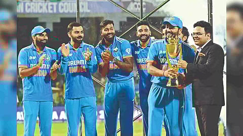 Rohit Sharma receives the trophy from Jay Shah