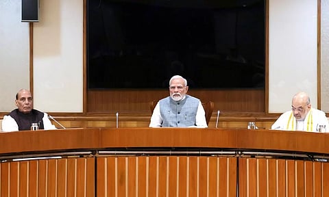 PM Narendra Modi chairs the Union Cabinet meeting in New Delhi on September 18, 2023. Defence Minister Rajnath Singh and Union Home Minister Amit Shah are also seen. (PTI)
