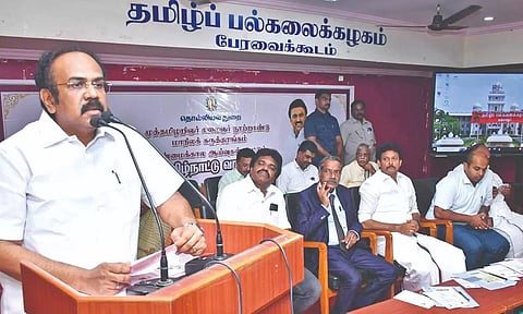 Minister Thangam Thennarasu speaking at a conference at Thanjavur Tamil University on Thursday