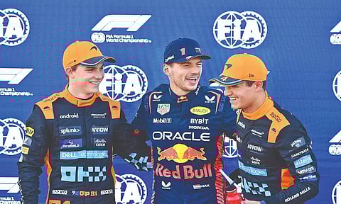McLaren's Oscar Piastri (left), Red Bull's Max Verstappen and McLaren's Lando Norris pose after the qualifying session&nbsp;