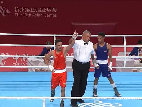 Boxer Deepak (in red) after the bout (Image: Twitter/ SAI)