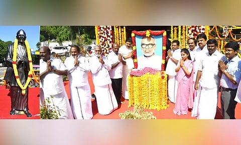DMK leaders paying respects to the portrait of Si Pa Aditanar.