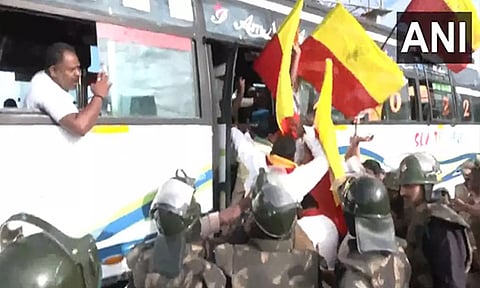 Visuals from protests near Attibele, Karnataka. (ANI)