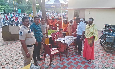 Police obtaining fingerprints of sadhus coming in for girivalam in Tiruvannamalai
