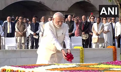 PM Modi pays his tributes to Mahatma Gandhi at Rajghat. (ANI)