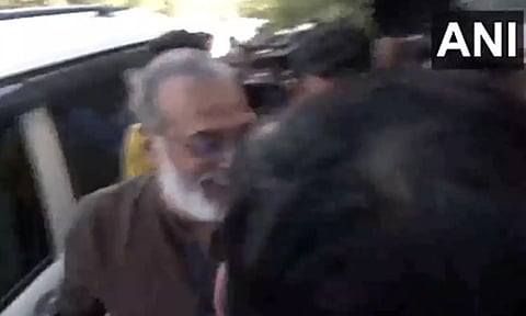 Founder and Editor-in-Chief of NewsClick Prabir Purkayastha at Delhi Police Special Cell office. (ANI)