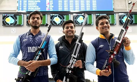 Indian shooters Rudrankksh Patil (R) and Aishwary Pratap Singh Tomar (C) and Divyansh Singh Panwar during the qualification round of men's 10m Air Rifle event at the 19th Asian Games (PTI)