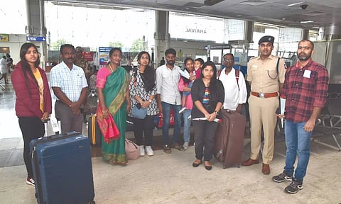 Collector MS Sangeetha and other officials welcome the returnees from Israel at Madurai airport on Sunday.