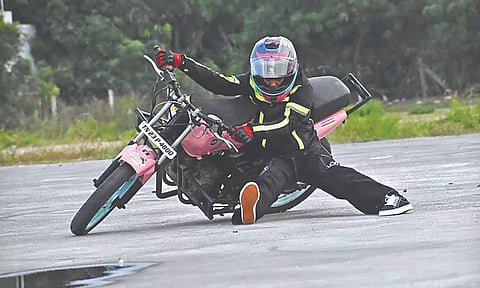 Hema Apsara performing human compass bike stunt