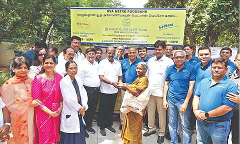 Subramanian handing over lunch token to an attendant.