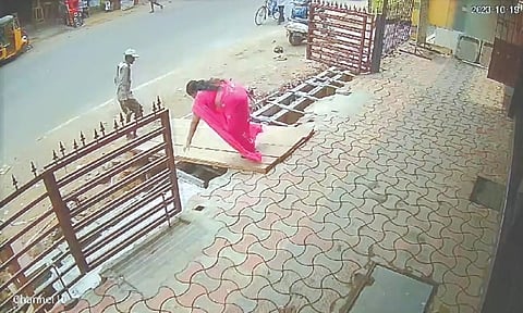 CCTV footage showing the woman falling into the drain.