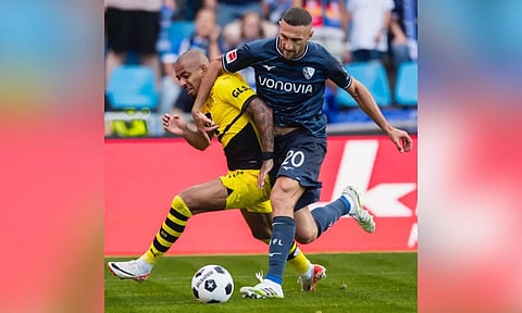 Dortmund edges Bremen to go top in Bundesliga