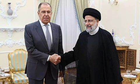 Russian Foreign Minister Sergei Lavrov shakes hands with Iranian President Ebrahim Raisi during a meeting in Tehran, Iran (Photo: Reuters)