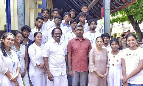 Minister T Mano Thangaraj, Collector PN Sridhar and students of Putheri Govt Hr Sec School near the new sanitary complex in Kanniyakumari on Tuesday