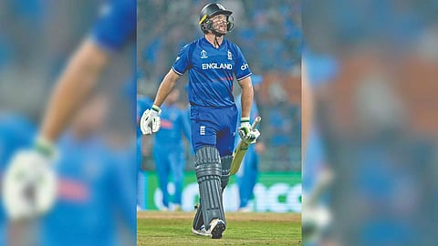Jos Buttler walks back dejected after getting out to Kuldeep Yadav
