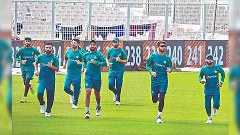 Pakistan cricketers warm up during their training session on the eve of their match against Bangladesh
